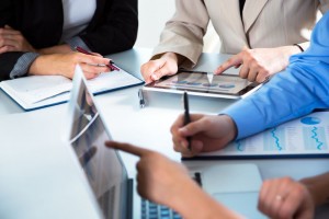 @chagin - Fotolia.com Group of businesspeople busy discussing financial matter during meeting